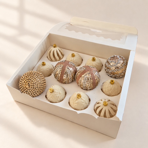 Champagne and Ivory twelve-bauble set in its open white box